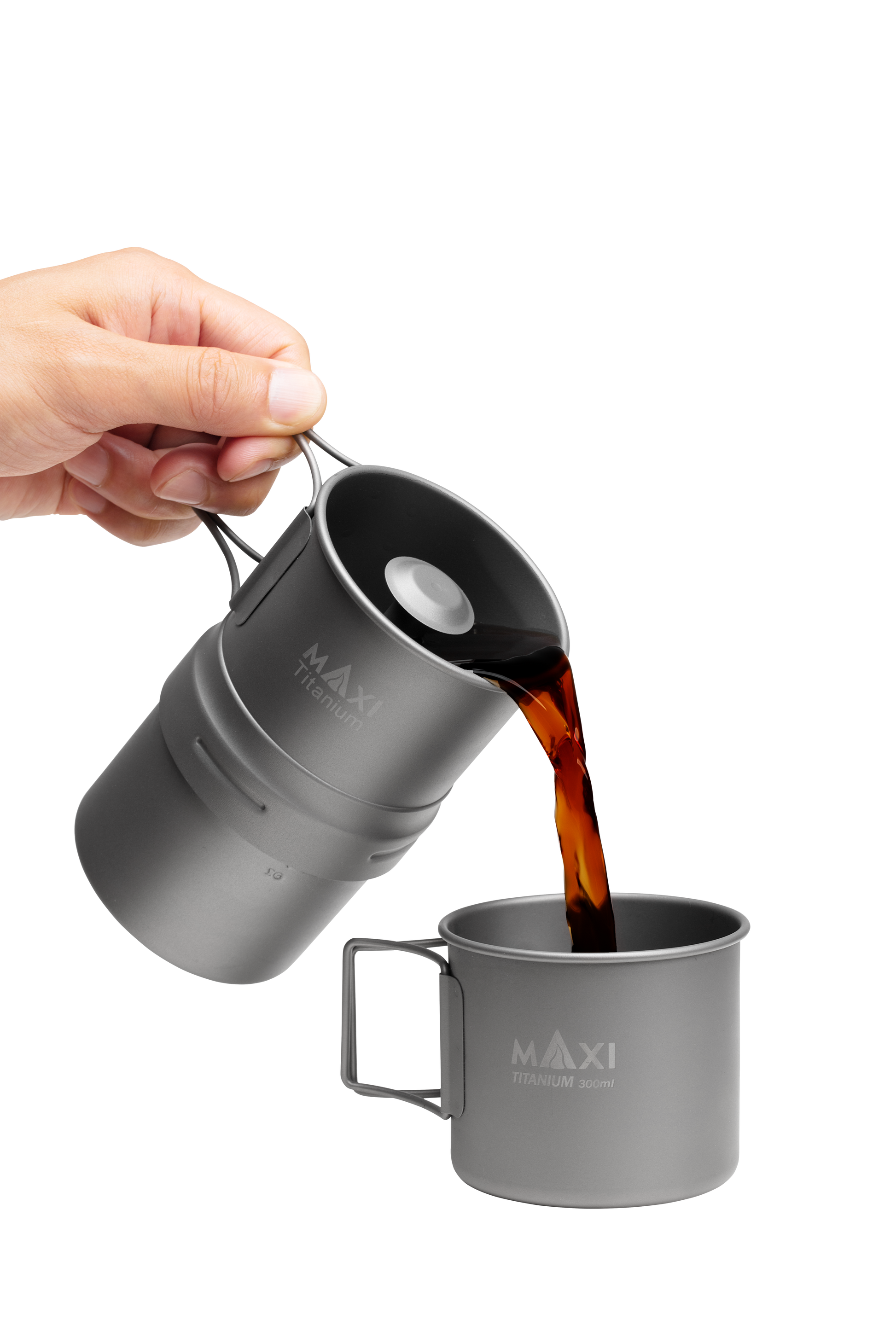 Pouring Coffee from the Maxi Titanium Coffee Maker to the titanium C-300 coffee mug